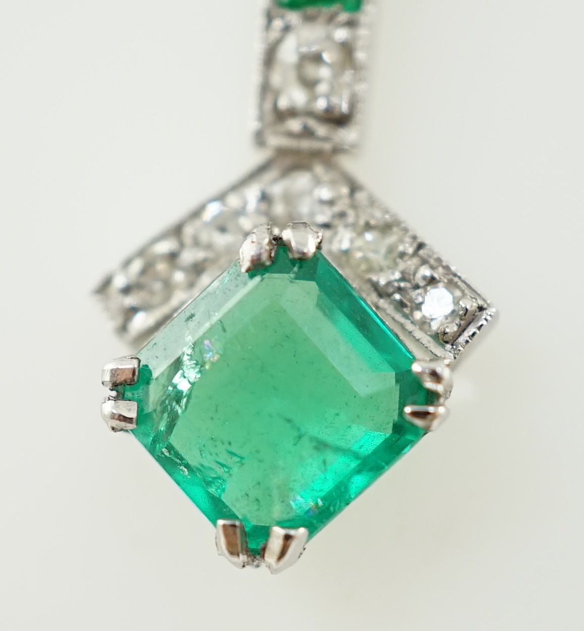 A 1920's platinum?, emerald and diamond set pendant necklace